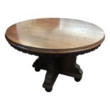 A late Victorian oak circular dining table, height 86cm, diameter 126cm.