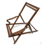 A vintage teak folding deck chair, probably 1920s, lacks canvas. (Dimensions: Height 130cm (