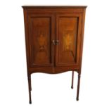An Edwardian inlaid mahogany two door cupboard, height 137cm, width 77cm.
