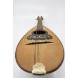 An Italian mandolin, with paper label inscribed 'Carlo Loveri & Figlio of Napoli'. (Dimensions: