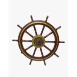 A 19th century hardwood brass mounted ship's wheel, the ten spokes with turned ends (one