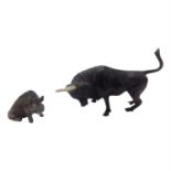 A bronze model of a bull and a cold painted model of a seated boar (2). (Dimensions: Bull 3.5cm