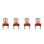 A set of four Victorian mahogany dining chairs.