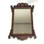 A George III style mahogany wall mirror. (Dimensions: 66 x 40cm.)(66 x 40cm.)