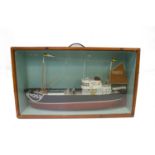 A model of a trawler, painted decoration, FH 253, in a glazed front case. (Dimensions: Length