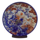 A Japanese Imari charger, 19th century, depicting birds and flowering branches, together with a