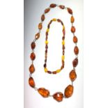 Two amber necklaces, lengths 83cm and 46.5cm.