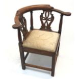 A George III oak corner armchair, with a double vase shaped pierced splat. (Dimensions: Height