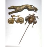 A fly stickpin with cut steel wings, a greyhound silver plated brooch and a bicycle brooch.