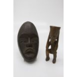 An African carved wood figure and an African mask (2). (Dimensions: Height 23cm and 28cm