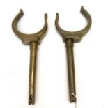 A pair of bronze rowlocks, probably early 20th century, admiralty broad arrow mark. (Dimensions: