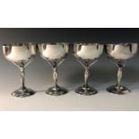 A set of four silver Art Nouveau goblets by Holland, Aldwinckle & Slater, the stems modelled as