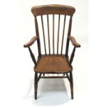 A 19th century elm and beech farmhouse windsor armchair, with a spindle filled back.
