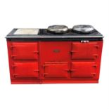 A large red AGA range oven, with five doors. (Dimensions: Height 89cm, width 148cm.)(Height 89cm,