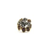 A heavy 1970's 18ct gold naturalistic ring set diamonds and rubies.