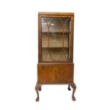 A walnut display cabinet, early 20th century. (Dimensions: Height 147cm,  width 54cm.)(Height 147cm,