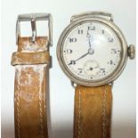An Omega wristwatch with brown leather strap.