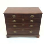 A George III mahogany chest of drawers, with two short and three long graduated drawers, on