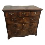 A George II oak and walnut chest of drawers, with three long and three short drawers, on bracket