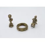 Two African cast brass figures of musicians, height 7.5cm, and a brass bangle.