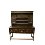 A Jacobean style oak dresser. (Dimensions: Height 186cm, width 154cm.)(Height 186cm, width 154cm.)