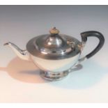 A silver teapot.
