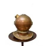 A reproduction copper and brass divers helmet. (Dimensions: height 42cm)(height 42cm)