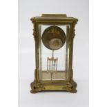 A French four glass mantel clock, the gilt case with ornate leaf and floral cast mounts, the dial