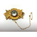 A Victorian bow shaped brooch set a small diamond.