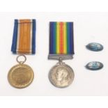 A pair of WW I medals to a D.H. R.N.R. together with two enamelled silver Isle Of Man brooches.