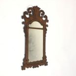 A George III style walnut wall mirror. (Dimensions: Height 88cm, width 43.5cm.)(Height 88cm, width