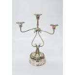 A silver plated three branch candelabrum, height 35.5cm, and a silver plated wine coaster (2).