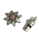 A silver whistle and a silver brooch set with iridescent paste.