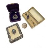 A compact a locket etc. (Dimensions: 20)(20)