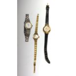 A Ladies Gucci pearl dial wristwatch and two other ladies watches.