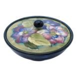 A Moorcroft 'Clematis' pattern bowl and cover, impressed mark to interior of cover and label to
