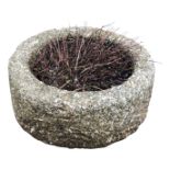 A circular granite planter. (Dimensions: Height 24cm, diameter 53cm.)(Height 24cm, diameter 53cm.)
