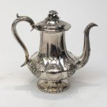 A William IV silver coffee pot with ornate floral decoration and flower finial makers mark for