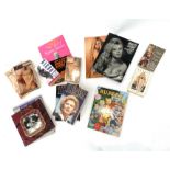 A collection of books, including Brigitte Bardot, Jane Fonda, Margaret Thatcher, David Bailey etc.