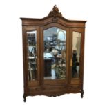 A Continental oak armoire, early 20th century.