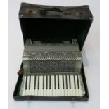 A German Rauner Virtuoso piano accordion, cased.