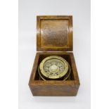 A ship's brass gimble compass, by Dobbie McInnes Ltd, Glasgow, contained within an ash case. (