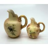 Two Royal Worcester blush ivory jugs, both pattern no. 1094, the largest painted with berries and