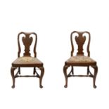 A set of six George I mahogany dining chairs, each with a vase shaped solid splat above a drop in