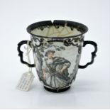 An 18th century twin handled porcelain cup, possibly Meissen, decorated with two figures in
