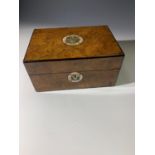 A burr walnut work box, with mother of pearl inlaid Prince of Wales feathers motif and fitted