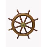 A hardwood and brass mounted ship's wheel, with eight turned square section spokes. (Dimensions: