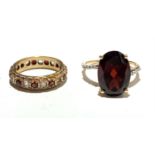 Two red stone set rings.