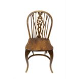 A single ash and elm wheel back windsor chair, circa 1900, with front cabriole legs..