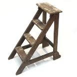 An early 20th century oak step ladder. (Dimensions: Height 71cm, width 32cm.)(Height 71cm, width